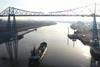 A dredger sailing under the Tees Transporter Bridge, teesport on freeport bidding, nov 2020