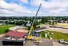 An overhead view of one half of a modular classroom being moved by Omega Morgan’s 350-tonne crane.