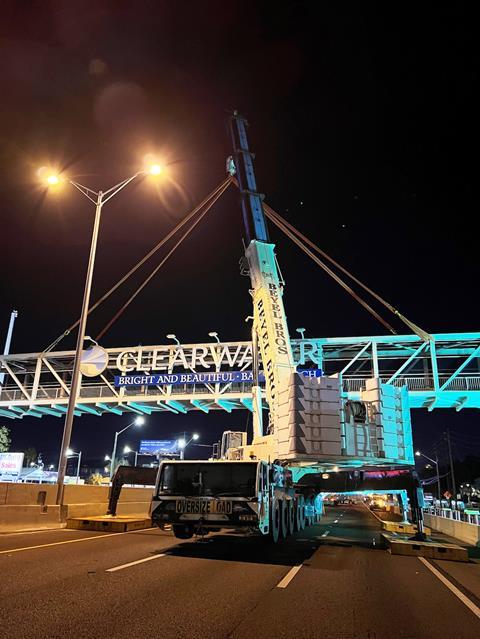 Hubbard and Beyel Brothers install pedestrian bridge at night copy