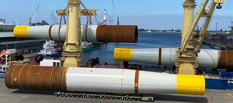 Monopiles being loaded at EEW quayside in Rostock, Germany.