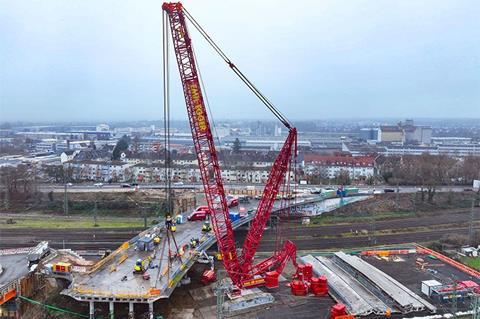 LR 1700-1.0 used to dismantle bridge at Swiss railway station 1