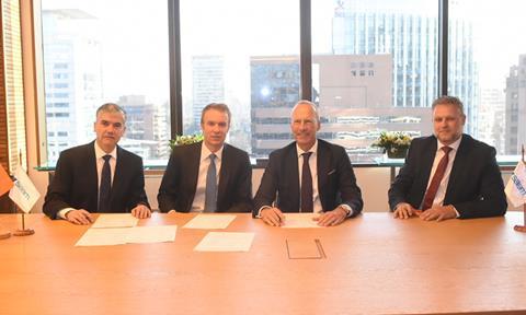 The signing ceremony for Hapag-Lloyd's acquisition of SAAM's port terminals and logistics business