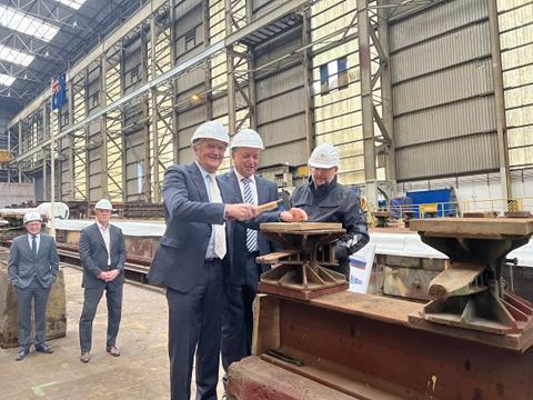 SeaRoad Executive Chairman Chas Kelly hammers nails into keel plate with SeaRoad Chief Operating Officer Patrick Guarino (1)